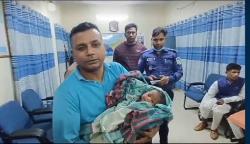 নবজাতক শিশুকে কুড়িয়ে কোলে তুলে নিলেন নান্দাইল থানা ওসি